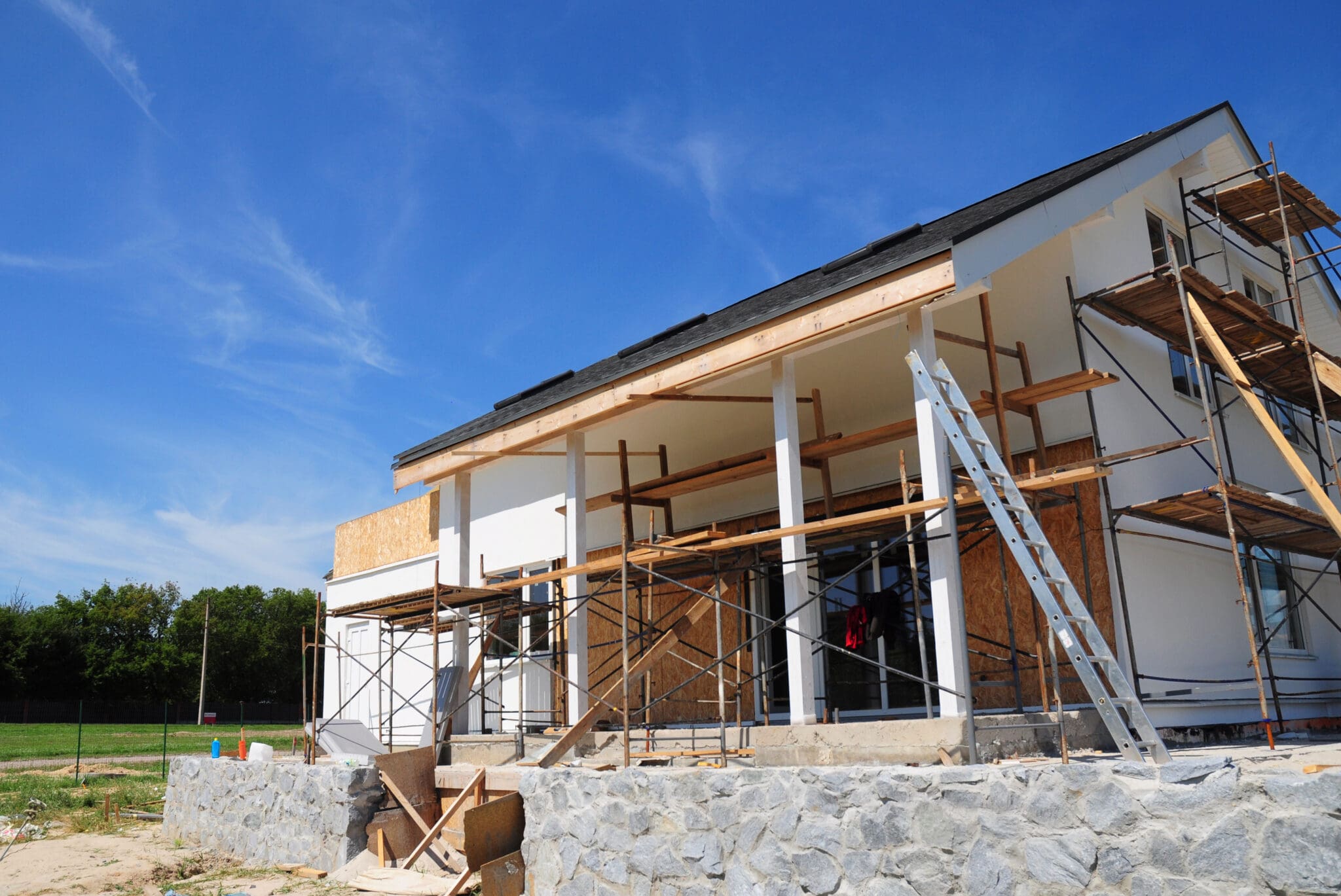 Modern house under construction with scaffolding